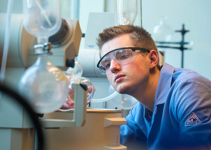 Student works with lab equipment