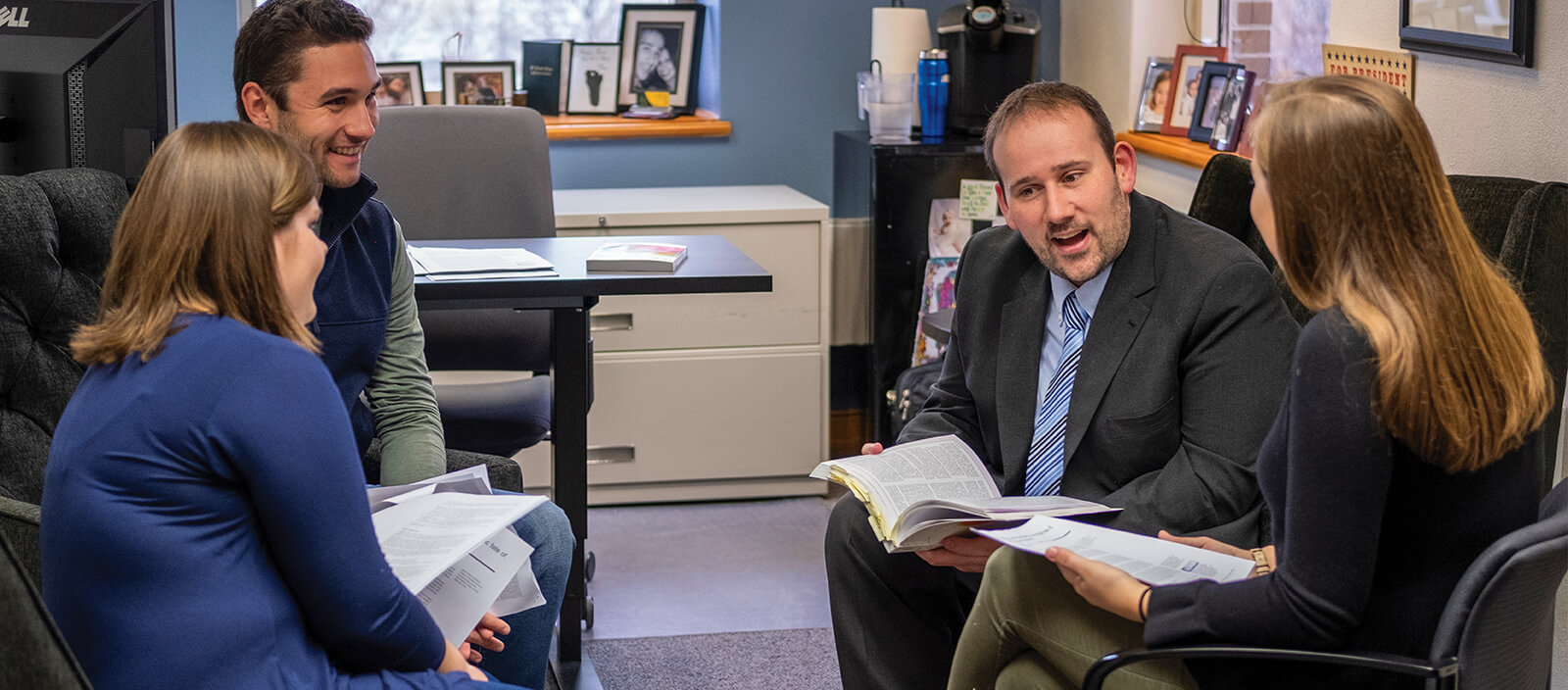 St. Norbert College Professor of Business Administration, Jamie O'Brien, holds office hours with students.